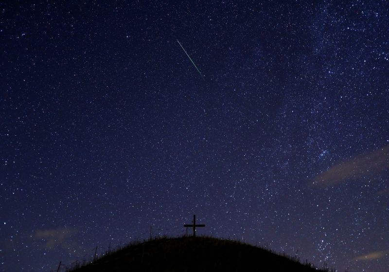 A meteor streaks past stars in the night sky above Leeberg hill during the Perseid meteor shower in Grossmugl, Austria August 14, 2017. u00e2u20acu201d Reuters pic