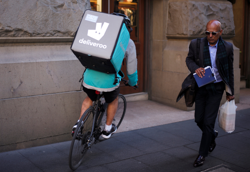 A rider for food delivery company Deliveroo cycles down a sidewalk in Sydney September 1, 2017. u00e2u20acu201d Reuters pic