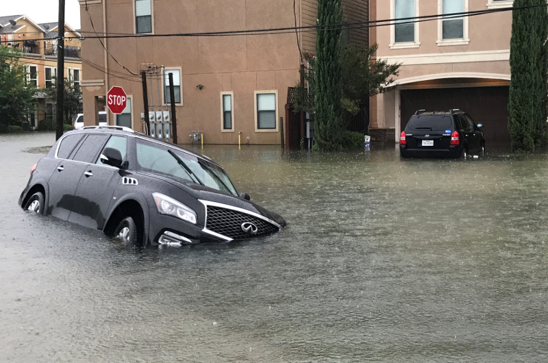 A vehicle sits half submerged in flood waters in a residential area in the aftermath of Hurricane Harvey in Houston, Texas August 27, 2017. u00e2u20acu201d Reuters picnn