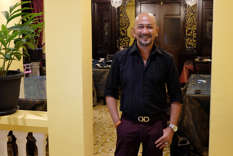 Designer and chef Richard Rivalee poses in his newly opened restaurant.