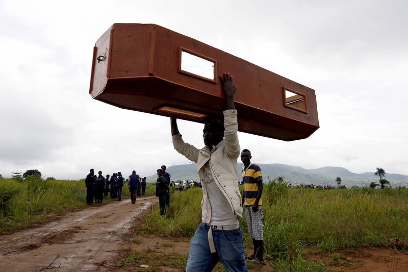 A man carries an empty coffin at the Paloko cemetery in Waterloo, Sierra Leone, August 17, 2017. u00e2u20acu201d Reuters pic