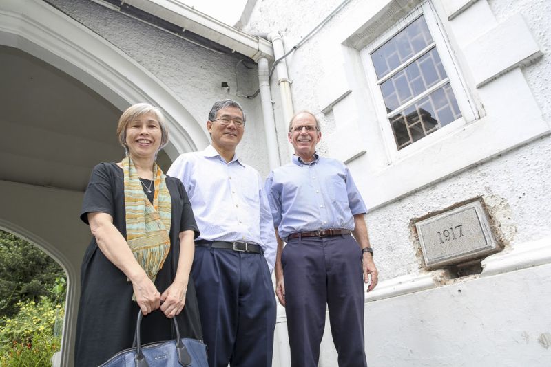St Andrew's church elders Chin Chin Liew, CJ Lim, senior pastor Rev Dr Robert Weniger (from left to right) are seen in front of the building's wall, where a small gap shows where the time capsule was placed back in 1917. ― Picture by Choo Choy May