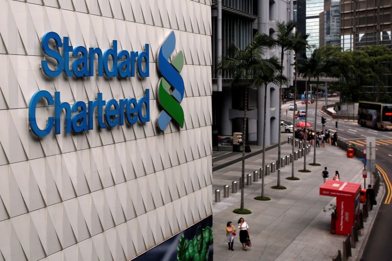 People walk outside the main branch of Standard Chartered in Hong Kong August 1, 2017. u00e2u20acu201d Reuters pic