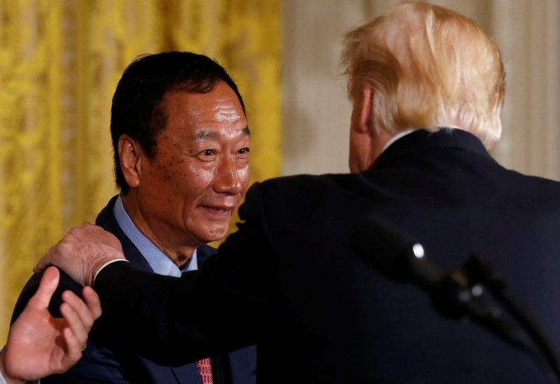 Foxconnu00e2u20acu2122s Terry Gou shakes hands with US President Donald Trump during a White House event where the Taiwanese electronics manufacturer announced plans to build a US$10 billion dollar LCD display panel screen plant in Wisconsin, in Washington, July 26, 