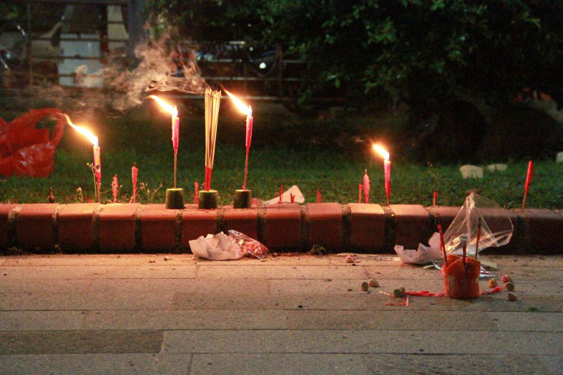 During the Hungry Ghost Festival, some HDB estates set up a communal spot where people come together to burn paper money and leave offerings for all spirits. u00e2u20acu201d Picture by Esther Leong/TODAY