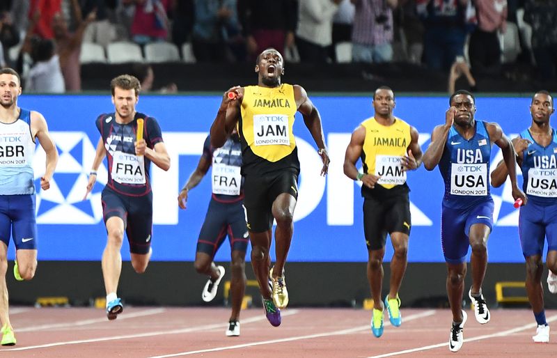 Jamaicau00e2u20acu2122s Usain Bolt (centre) reacts after hurting himself during the final of the menu00e2u20acu2122s 4x100m relay athletics event at the 2017 IAAF World Championships at the London Stadium in London on August 12, 2017. u00e2u20acu201d AFP pic