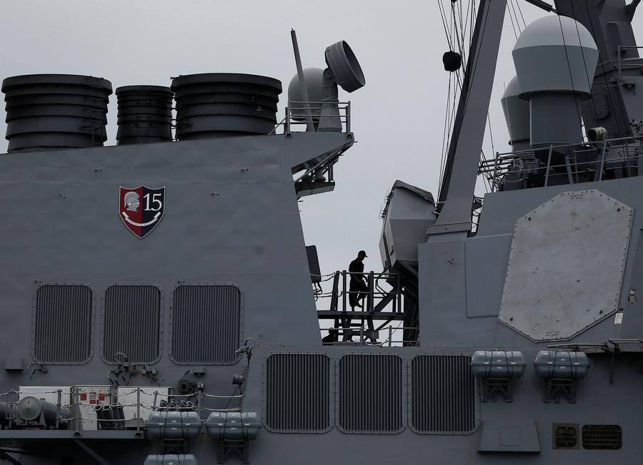 Work being done on the damaged US Navy guided-missile destroyer USS John S. McCain in Singapore waters August 21, 2017 after a collision. u00e2u20acu201d Reuters