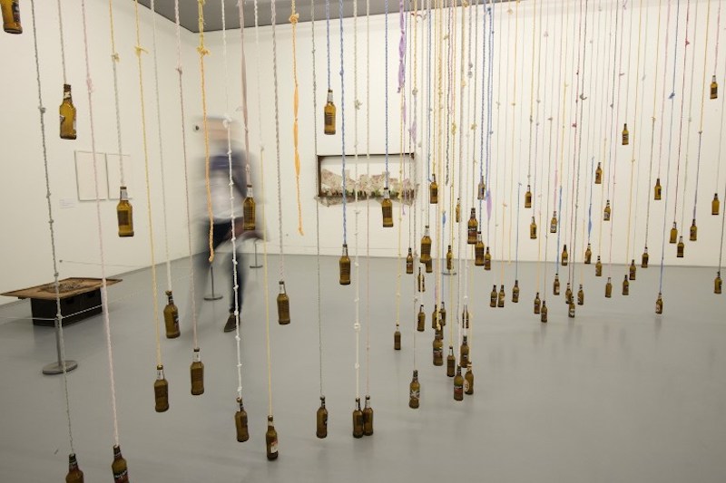 A visitor walks past an artwork by artist Lungiswa Gqunta hanging in The Zeitz Museum of Contemporary African Art in Cape Town September 15, 2017. — AFP pic