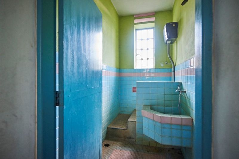 The bathroom before restoration. — Picture courtesy of The Edison George Town