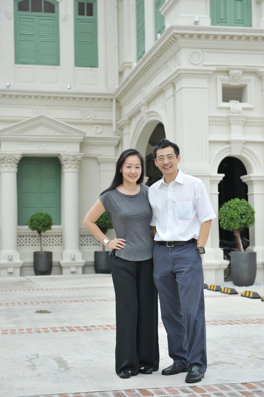 Rina Teoh and Eugene Tan posing in front of ET Group’s flagship hotel, The Edison George Town. — Picture by KE Ooi