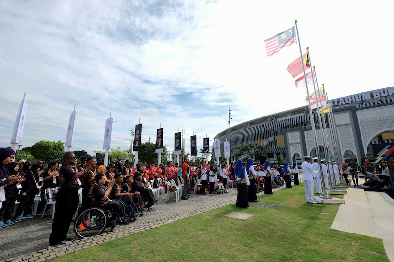 The Jalur Gemilang is raised along with the flags of 10 other contingents taking part in the 9th Asean Para Games in Kuala Lumpur at the Bukit Jalil National Stadium, September 16, 2017. u00e2u20acu201d Bernama pic