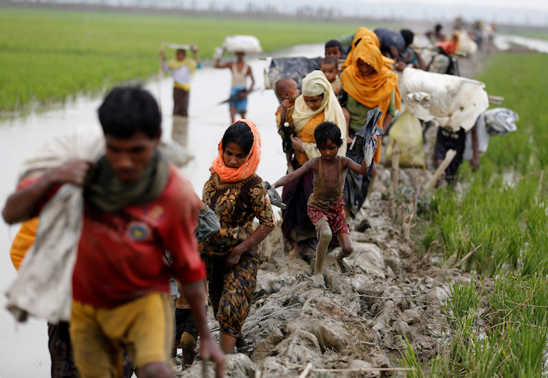 Rohingya refugees walk on the muddy path after crossing the Bangladesh-Myanmar border in Teknaf, Bangladesh, September 3, 2017. u00e2u20acu201d AFP pic