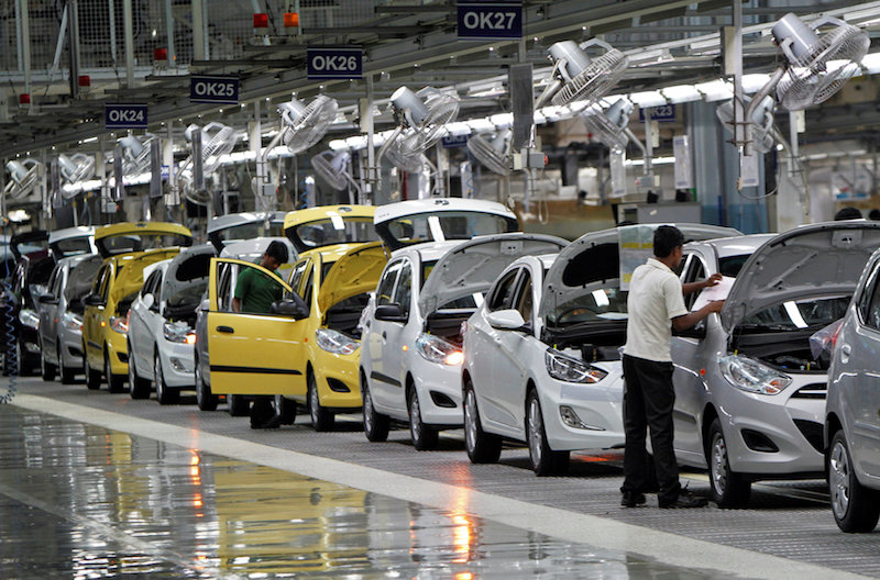 Workers assemble cars inside the Hyundai Motor India Ltd plant at Kancheepuram district in the southern Indian state of Tamil Nadu October 4, 2012. u00e2u20acu201d Reuters pic