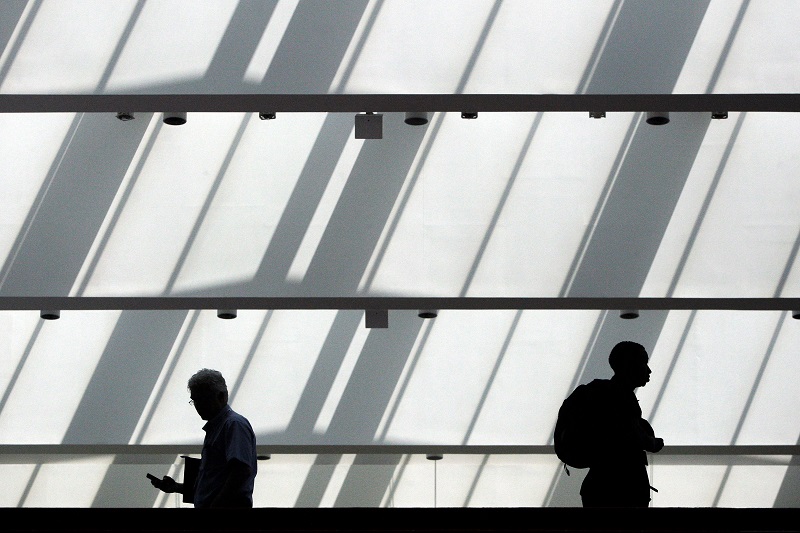 Men walk in the hall outside a Hire Our Heroes job fair targeting unemployed military veterans and sponsored by the Cable Show, a cable television industry trade show in Washington, June 11, 2013.  u00e2u20acu201d Reuters pic