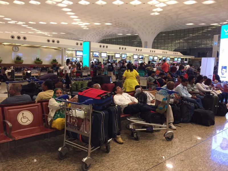 Stranded passengers are pictured at the Chhatrapati Shivaji International Airport in Mumbai September 20, 2017. u00e2u20acu201d Picture by Norsila Leenn