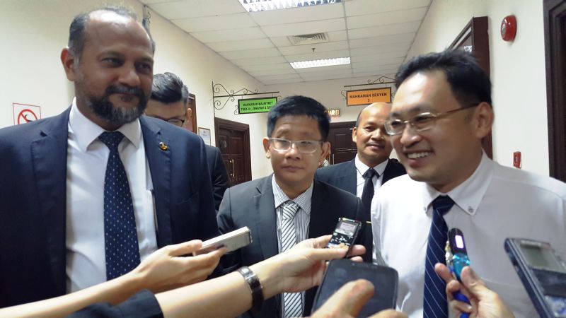 Sarawak DAP chairman Chong Chieng Jen (right) with counsel Gobind Singh Deo and Julian Tan (centre) speaking to reporters after the court has delivered its ruling, September 14, 2017. u00e2u20acu2022 Picture by Sulok Tawie