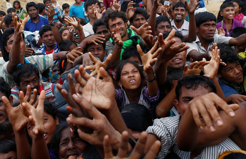 Rohingya refugees stretch their hands to receive food distributed by local organisations in Kutupalong, Bangladesh, September 9, 2017. u00e2u20acu201d Reuters pic