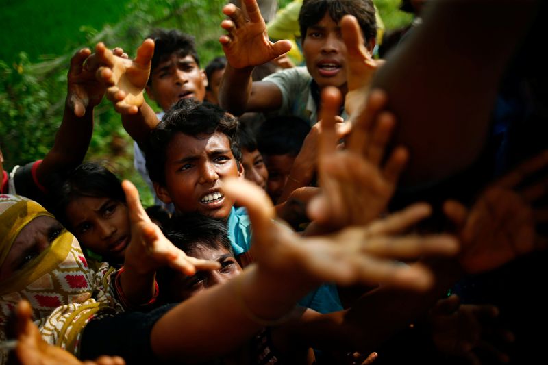 Rohingya refugees stretch their hands for food near Balukhali in Coxu00e2u20acu2122s Bazar, Bangladesh, September 4, 2017. u00e2u20acu201d Reuters pic