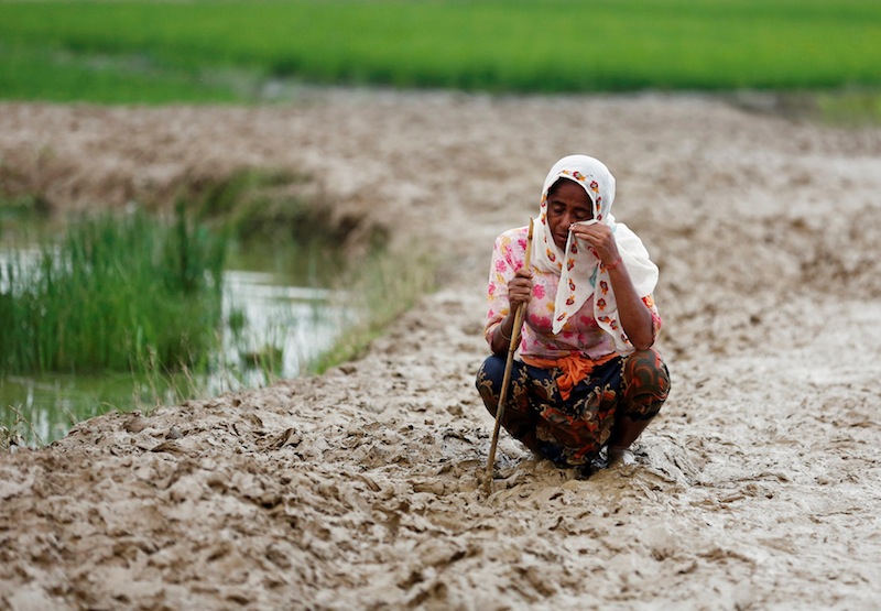 A Rohingya refugee woman wipes her eyes as she cries after crossing the border, in Teknaf, Bangladesh September 3, 2017. u00e2u20acu201d Reuters pic 