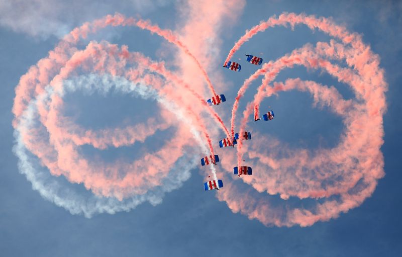 File picture shows an RAF parachute display team letting off smoke canisters as they descend as part of a ceremony for the Queenu00e2u20acu2122s Baton Relay for the 2018 Gold Coast Commonwealth Games at Brize Norton, Britain August 16, 2017. u00e2u20acu201d Reuters pic