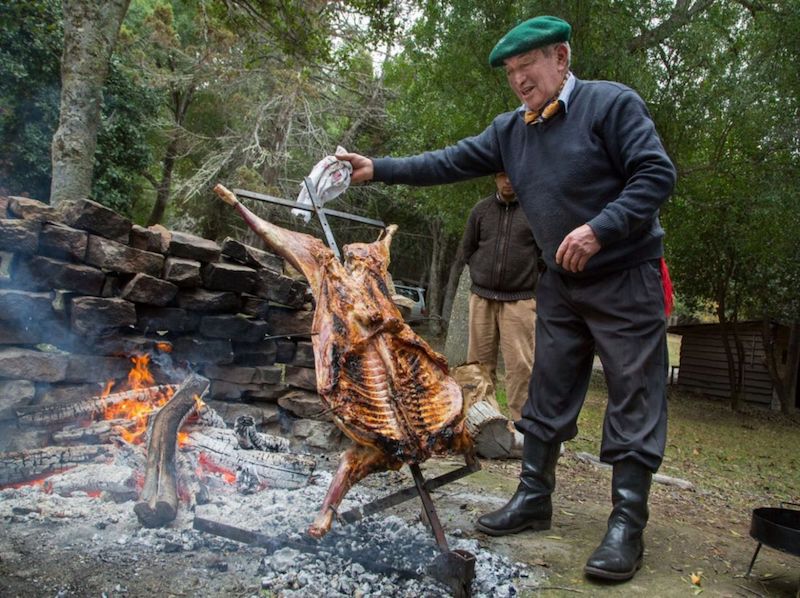 A Patagonia asado gaucho cooks lamb. — TODAY pic