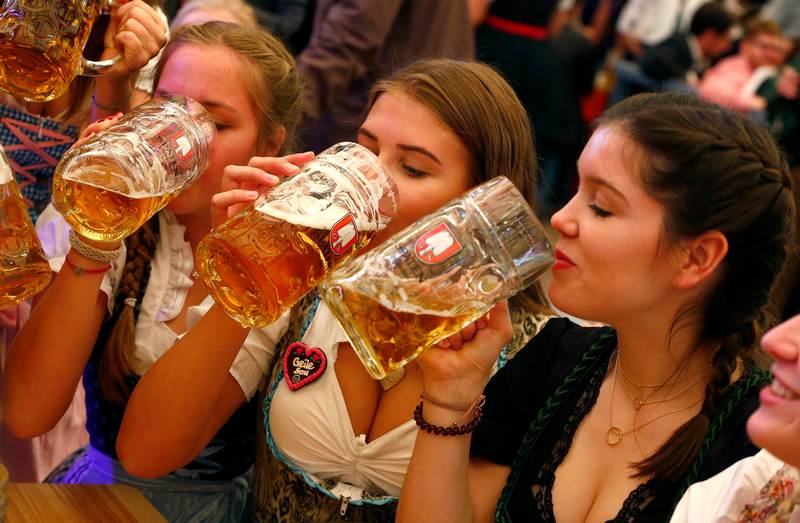 Visitors drink beer during the opening day of the 184th Oktoberfest in Munich September 16, 2017. u00e2u20acu201d Reuters pic 