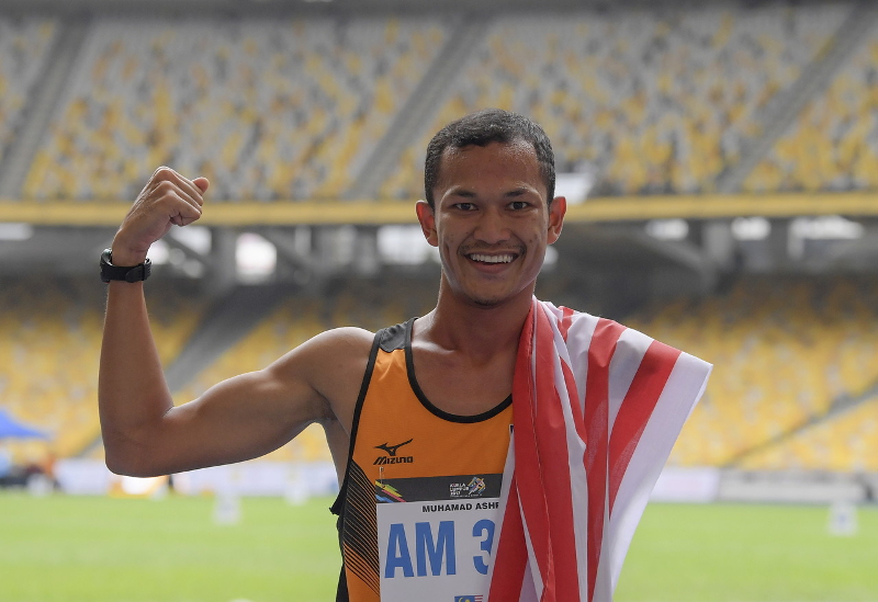 National athlete Muhamad Ashraf Muhammad Haisham celebrates his win in the 1,500m Menu00e2u20acu2122s T46 race at the 9th Asean Para Games in Kuala Lumpur September 20, 2017. u00e2u20acu201d Bernama pic