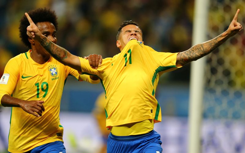 Philippe Coutinho (11) of Brazil celebrates his goal against Ecuador with teammate Willian. u00e2u20acu2022 Reuters pic