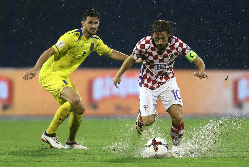 Croatiau00e2u20acu2122s Luka Modric in action with Kosovou00e2u20acu2122s Enis Alushi during their 2018 World Cup Qualifications match in Zagreb, Croatia, September 2, 2017. u00e2u20acu201d Reuters pic