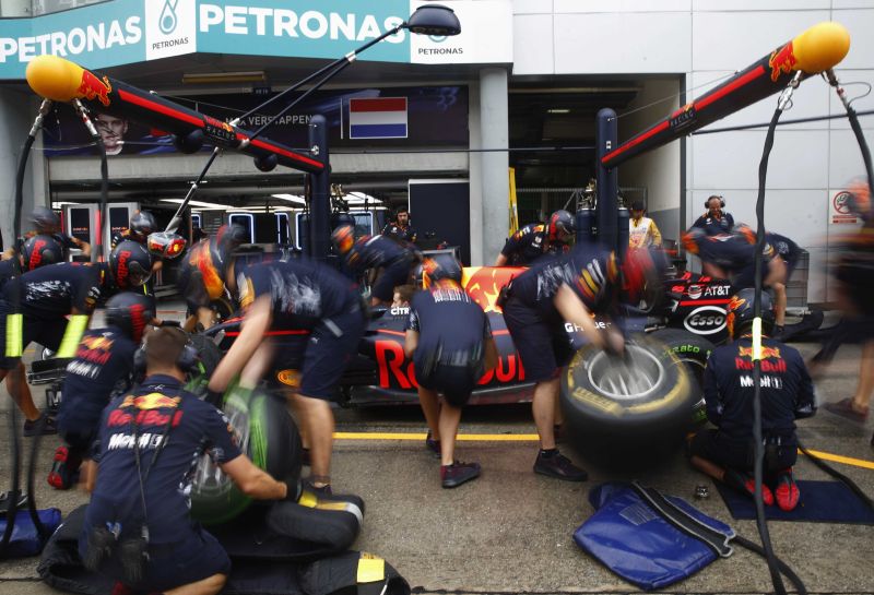 Redbull's pit crew practise changing tyres on Daniel Ricciardo's car during the Malaysia Grand Prix 2017u00e2u20acu2122s practice session, September 29, 2017. u00e2u20acu2022 Reuters pic