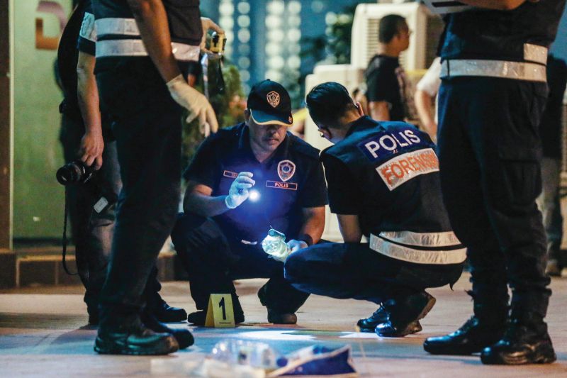 Forensics police gather evidence at the entertainment outlet in Kota Damansara where the attack took place. u00e2u20acu201d Picture by Hari Anggara