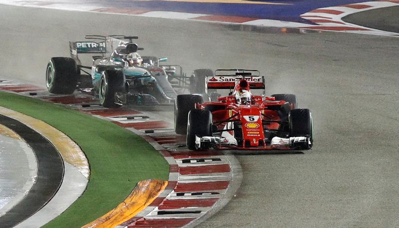 Ferrari's Sebastian Vettel leads Mercedes' Lewis Hamilton at the start of the Singapore Grand Prix September 17, 2017. u00e2u20acu201d Reuters pic 