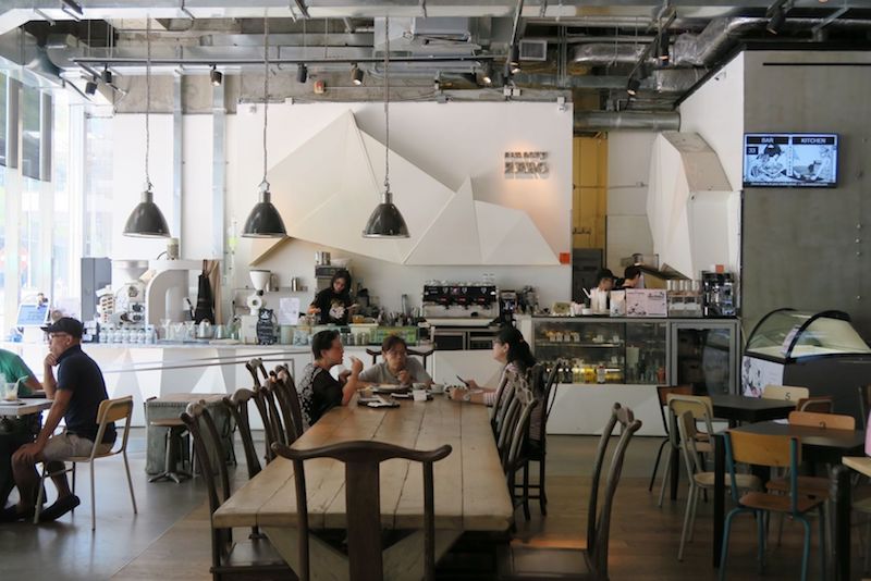 Sensory Zero, a multi-concept café with high ceilings and exposed concrete walls in a swanking office building One Island South. — TODAY pic