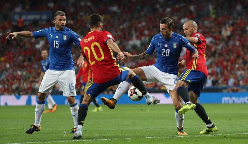 Italyu00e2u20acu2122s Andrea Barzagli (left) and Federico Bernardeschi in action with Spainu00e2u20acu2122s Marco Asensio and David Silva (right) during their 2018 World Cup Qualifications match in Madrid, September 2, 2017. u00e2u20acu201d Reuters pic