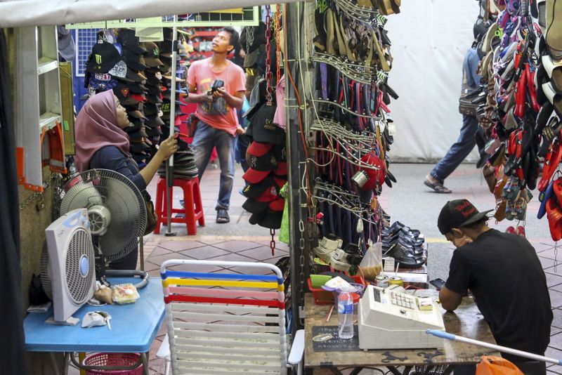 Traders like this one are found all over Jalan Masjid India and its surrounding streets. u00e2u20acu2022 Picture by Choo Choy May 