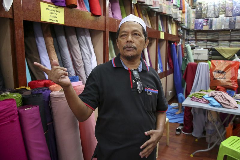 Abdul Rahman Abdul Bakar works as a supervisor at a store where you can make 'baju Melayu' in Jalan Masjid India.