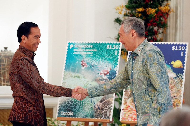 Indonesia's President Joko Widodo and Singapore's Prime Minister Lee Hsien Loong unveil a joint stamp issue at the Istana in Singapore September 7, 2017. u00e2u20acu201d Reuters pic 