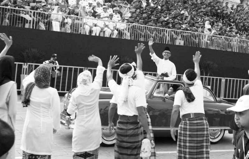 An actor portraying Tunku is driven past the grandstand. u00e2u20acu201d Picture by Sayuti Zainudin