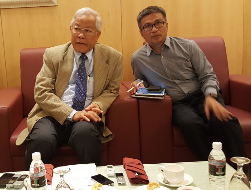 Manyin (left) says that conditions and low enrolment of schools affect the overall performance of students. u00e2u20acu201d Picture by Sulok Tawie 