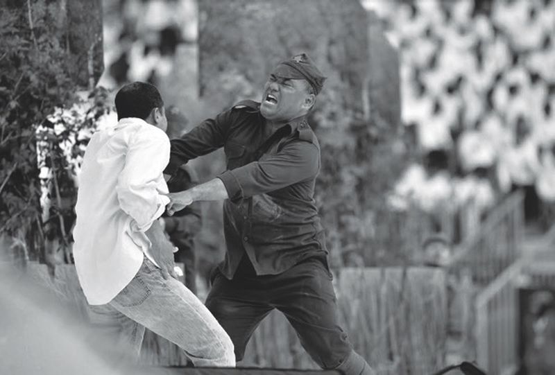 ‘Batman’ in a struggle with a ‘communist’.