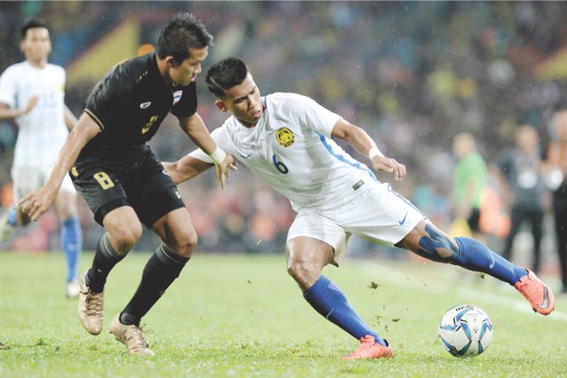 Safawi (right) says the age gap with senior players is no problem. u00e2u20acu201d Picture by Mukhriz Hazim