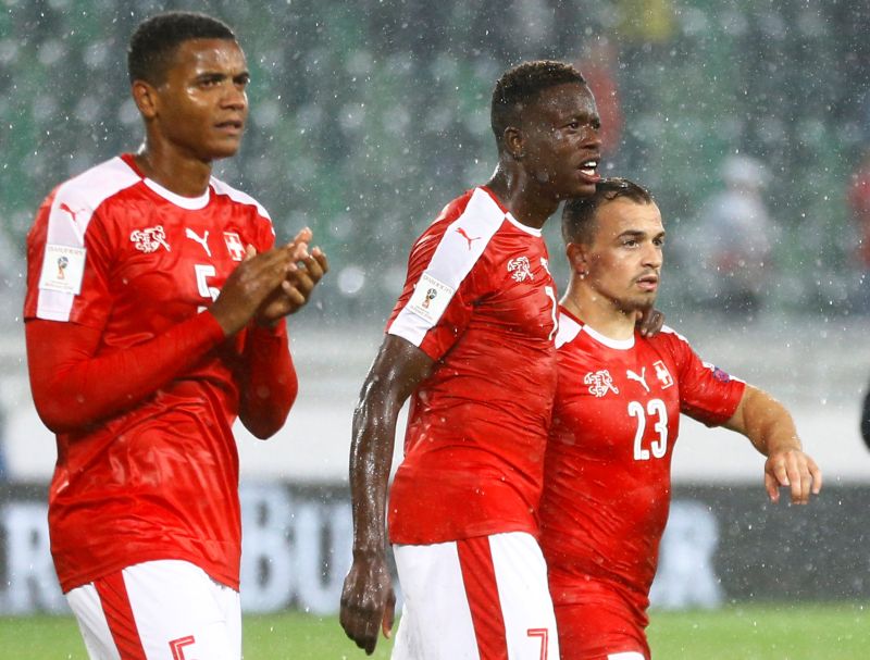 Switzerland's Xherdan Shaqiri, Denis Zakaria and Manuel Akanji celebrate after the match against Andorra. u00e2u20acu2022 Reuters pic