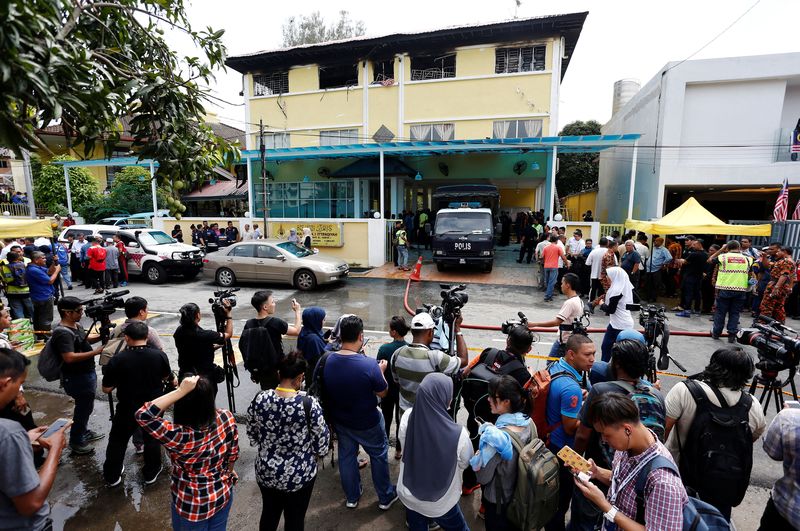 Media crowd outside religious school Darul Quran Ittifaqiyah after a fire broke out in Kuala Lumpur September 14, 2017. — Reuters pic