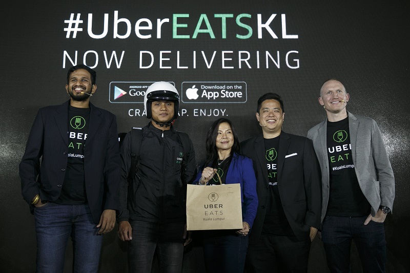 From left: General Manager of UberEATS Malaysia and Singapore Shri Gopalakrishnan, a UberEATS delivery-partner, Head of Marketing Uber Malaysia Geraldine Wong,  Uber Head of Communications Southeast Asia Leigh Wong and  UberEATS Regional General Manager  APAC Allen Penn and the launch. — Picture courtesy of UberEATS