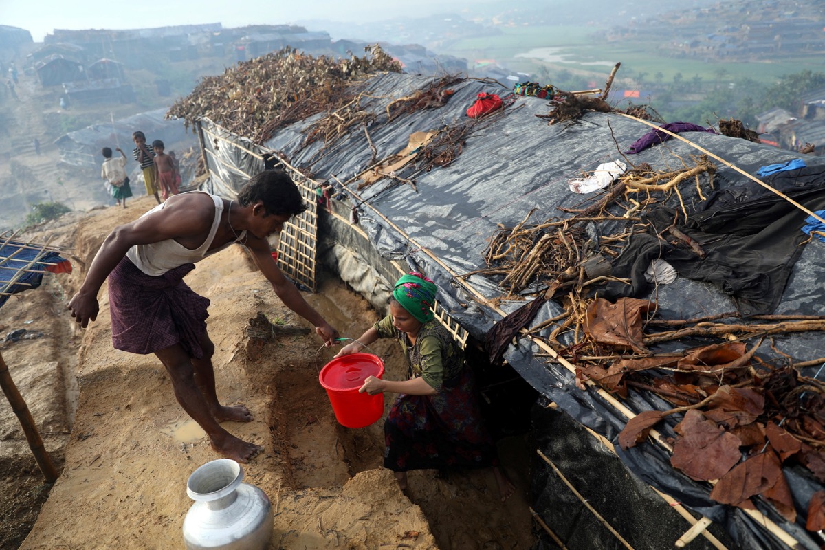 Rohingya refugees collect water at a refugee camp, in Palang Khali near Cox's Bazar,Bangladesh October 5, 2017. u00e2u20acu201d Reuters pic