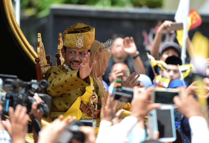 Brunei's Sultan Hassanal Bolkiah waves to people as he passes in a procession to mark his golden jubilee of his accession to the throne in Bandar Seri Begawan October 5, 2017. u00e2u20acu201d Reuters pic