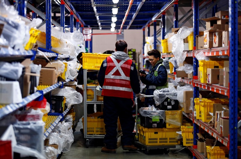 Employees work at RedMart’s fulfilment centre in Singapore September 22, 2017. Picture taken September 22, 2017.
