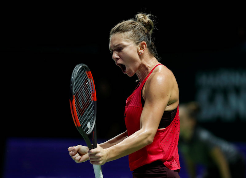Romaniau00e2u20acu2122s Simona Halep celebrates during her group stage match win against Franceu00e2u20acu2122s Caroline Garcia in the WTA Tour Finals in Singapore October 23, 2017. u00e2u20acu201d Reuters pic