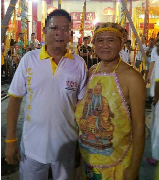 Lim Ba (right) was performing the u00e2u20acu02dchuman steamingu00e2u20acu2122 stunt last Monday night during the Nine Emperor God prayer session at a Chinese temple in Kuala Sanglang, Kedah. 