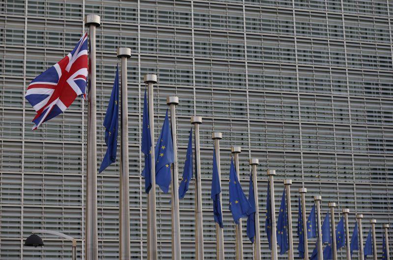 A Union Jack flag flutters next to European Union flags at the European Commission headquarters in Brussels, Belgium October 16, 2017. u00e2u20acu201d Reuters pic
